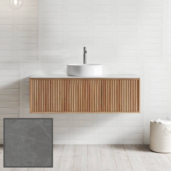 Ingrain Grooved wall hung vanity with fluted woodgrain drawers and grey stone top, shown in a bathroom setting