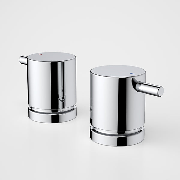 Caroma Luna chrome basin lever handles, pair of cylindrical taps on white background