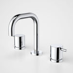 Caroma Luna chrome 3 piece basin tap set with rounded lever handles and curved spout on white background