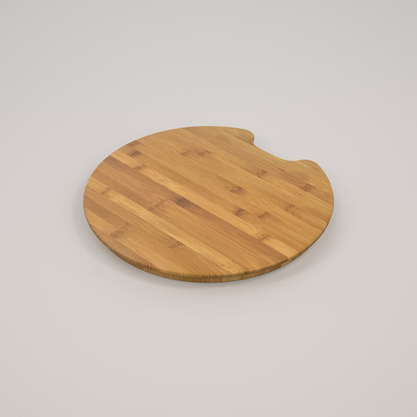 Caroma Luna round bamboo chopping board in natural wood, shown on a plain background with a notched round shape.