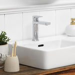 Clark Round Square basin mixer in chrome over a white bathroom basin