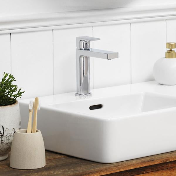 Clark Round Square basin mixer in chrome over a white bathroom basin