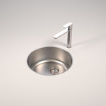 Caroma Luna round stainless steel bowl sink with chrome tap, overmount shown in a clean benchtop setting