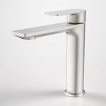 Caroma Urbane II mid tower basin mixer in brushed nickel, front angle view, with flat lever handle and slim spout