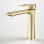 Caroma Urbane II mid tower basin mixer in brushed brass, shown front angle with lever handle and spout