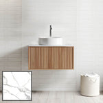 Ingrain Grooved wall hung vanity with fluted woodgrain front and round white basin on a white tiled bathroom wall