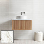 Ingrain Grooved wall hung vanity with fluted woodgrain drawers and white above-counter basin, front view in bathroom setting