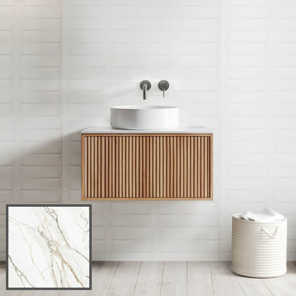 Ingrain Grooved wall hung vanity with fluted woodgrain drawers and white above-counter basin, front view in bathroom setting