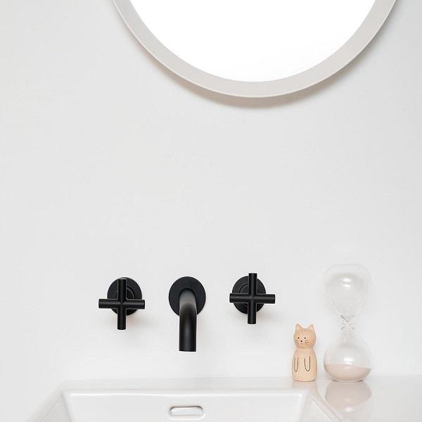 Clark Cross matte black 3 piece wall basin/bath set with cross handles and curved spout above a basin bench
