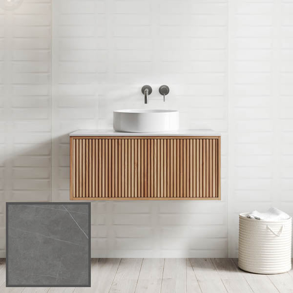 Ingrain Grooved wall-hung vanity with fluted woodgrain front, white basin and grey porcelain top in bathroom setting