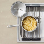 Oliveri Foldamate stainless steel bowl saver and saucepan on kitchen sink drainboard, top view