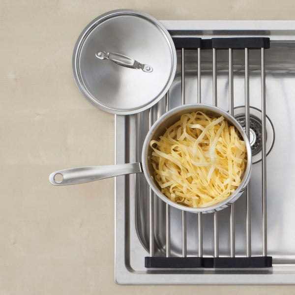Oliveri Foldamate stainless steel bowl saver and saucepan on kitchen sink drainboard, top view
