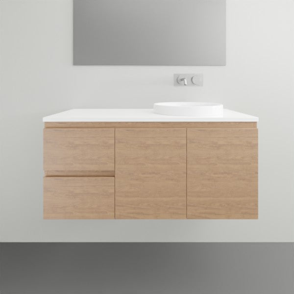 ADP Glacier Lite wall hung vanity with white top and oak woodgrain finish, shown in a bathroom with left basin location