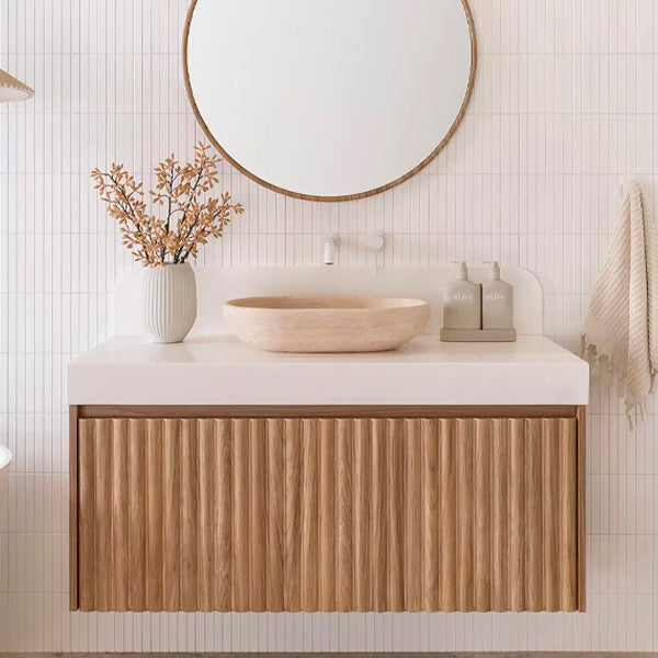 ADP Harper wall hung vanity in Prime Oak with white Caesarstone top, fluted drawers and round basin in a bathroom setting
