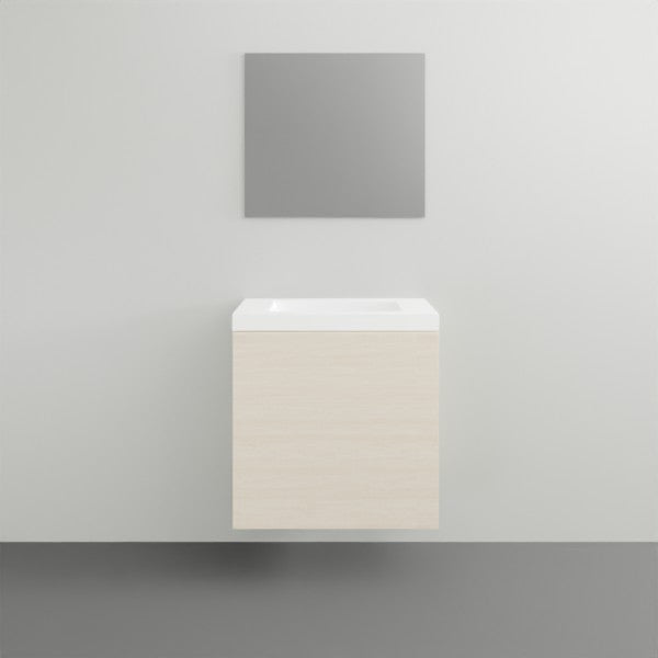 ADP Petite wall-hung vanity with white top and light woodgrain door front, shown in a minimalist bathroom setting
