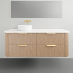 ADP Thirroul wall-hung vanity, timber finish with white top, curved ends and brass handles, shown with basin in front view