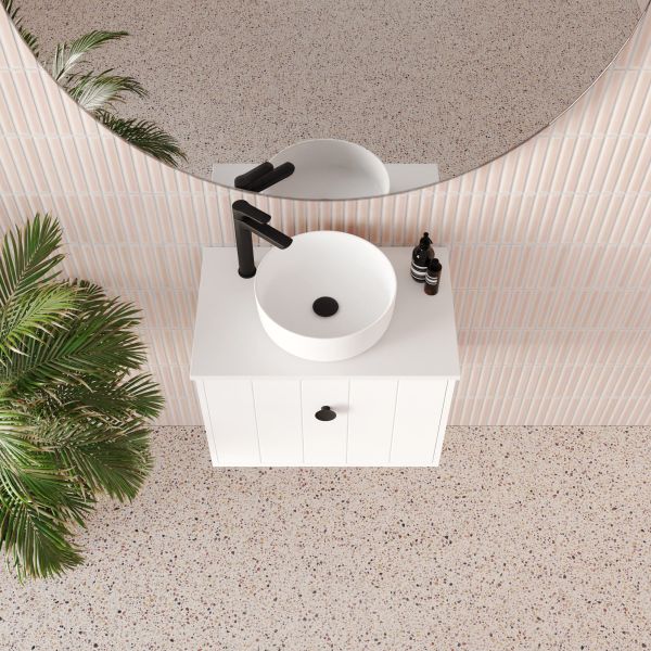 Marquis Anna wall-hung ensuite vanity in matte white, with round above-counter basin, black mixer and handles in a bathroom setting