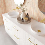 Marquis Anna wall hung vanity in white with gold handles, dual round basins and a slim benchtop in a bathroom setting