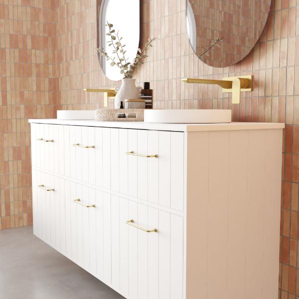 Marquis Anna wall hung vanity in matte white with vertical shiplap panels, gold handles and twin basins in bathroom setting