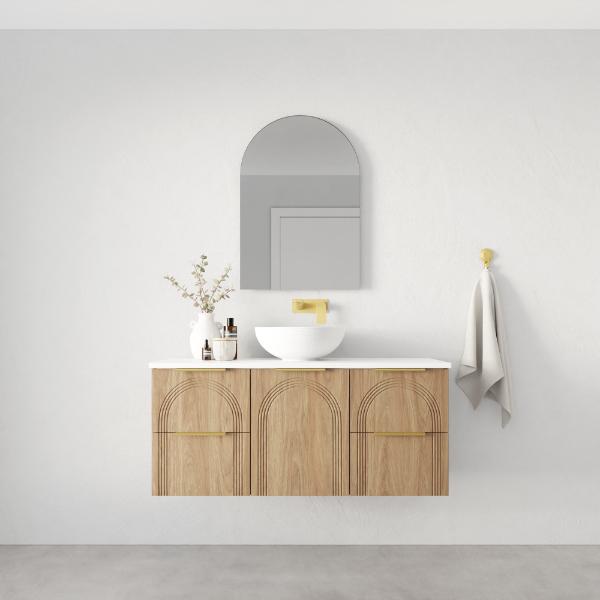 Marquis Arco wall hung vanity in prime oak with white top, round basin and brushed brass handle, front view