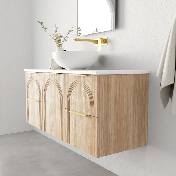 Marquis Arco wall hung vanity in prime oak finish with white top, arched front detail and brushed brass handles