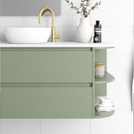 Marquis Avion wall hung vanity in sage green with white top, curved side shelves and round basin in bathroom setting