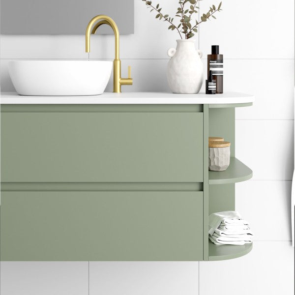 Marquis Avion wall hung vanity in sage green with white top, curved side shelves and round basin in bathroom setting