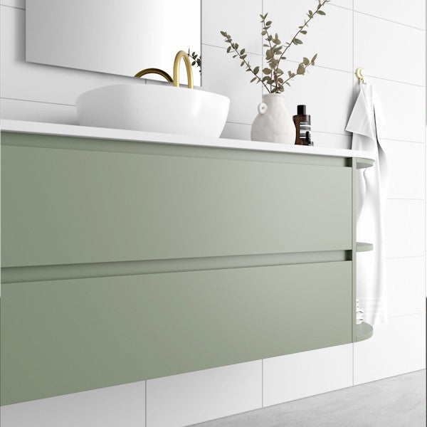 Marquis Avion wall hung vanity in sage green with white top, round basin and curved right-side shelf in bathroom setting