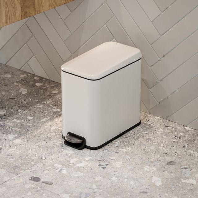 Bao Bath rectangular bathroom pedal bin in matt white, freestanding with black trim and foot pedal on a terrazzo floor.