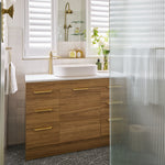 Phoenix Cromford twin shower in brushed gold, shown installed in a bathroom with overhead rose and handpiece