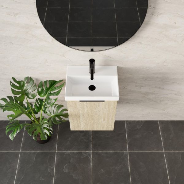 Marquis Caleta compact wall hung vanity in coastal oak with white ceramic top and black tapware in a bathroom setting