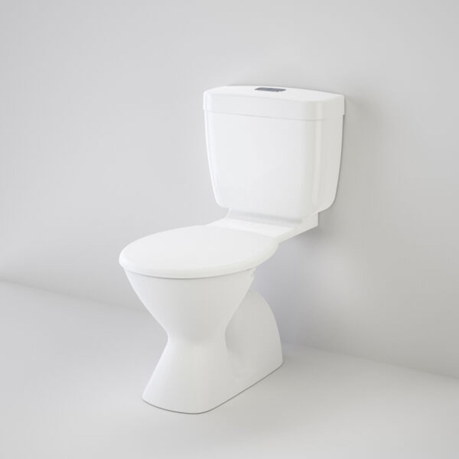 Caroma Aire Concorde white connector toilet suite, angled front view with concealed cistern and pan