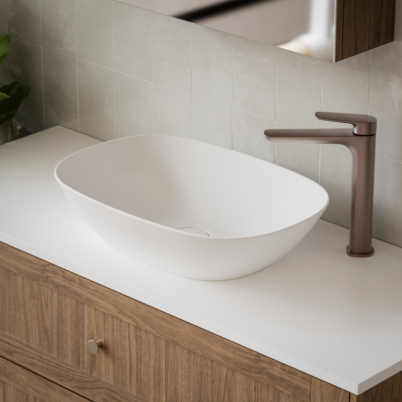 Caroma Contura II oval above-counter basin in matte white ceramic, shown on a timber vanity with tap in a bathroom setting