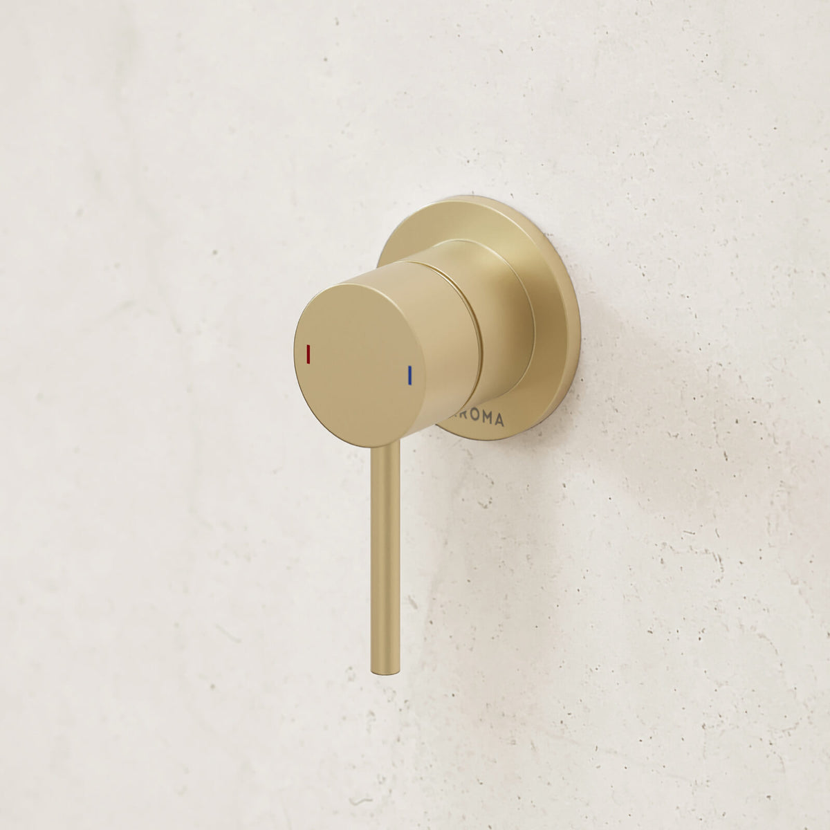 Caroma Liano II wall-mounted bath/shower mixer in brushed brass, with round plate and single lever on white wall