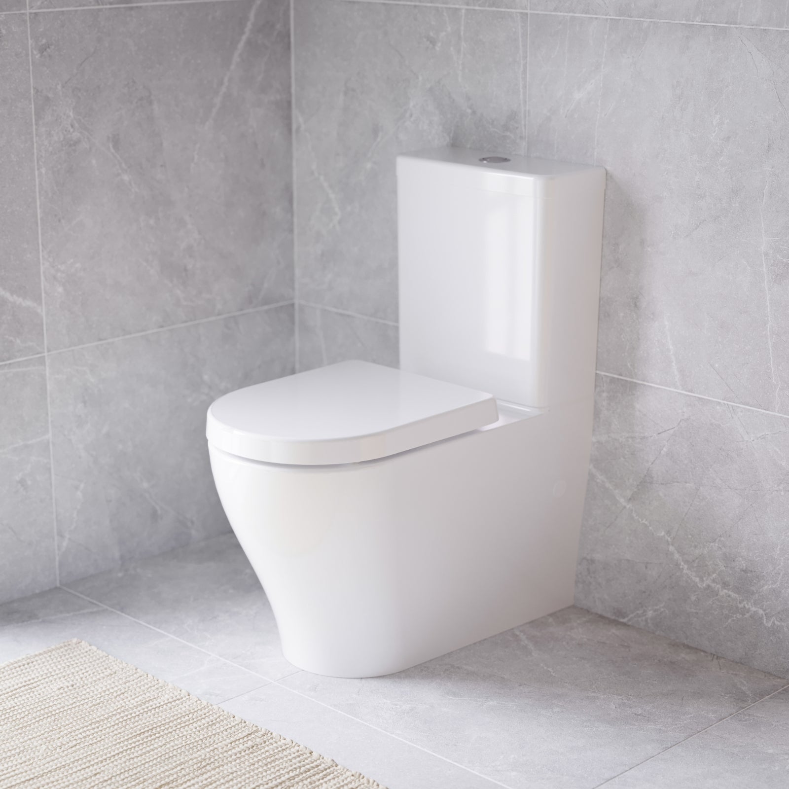 Caroma Luna white wall faced toilet suite with soft-close seat, shown in a modern tiled bathroom