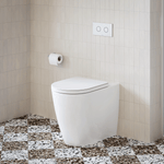Caroma wall-faced white toilet suite with in-wall cistern and dual flush button on tiled bathroom floor