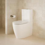 Caroma Urbane II Luxe wall-faced toilet suite in white, shown in a beige tiled bathroom with concealed cistern and soft-close seat