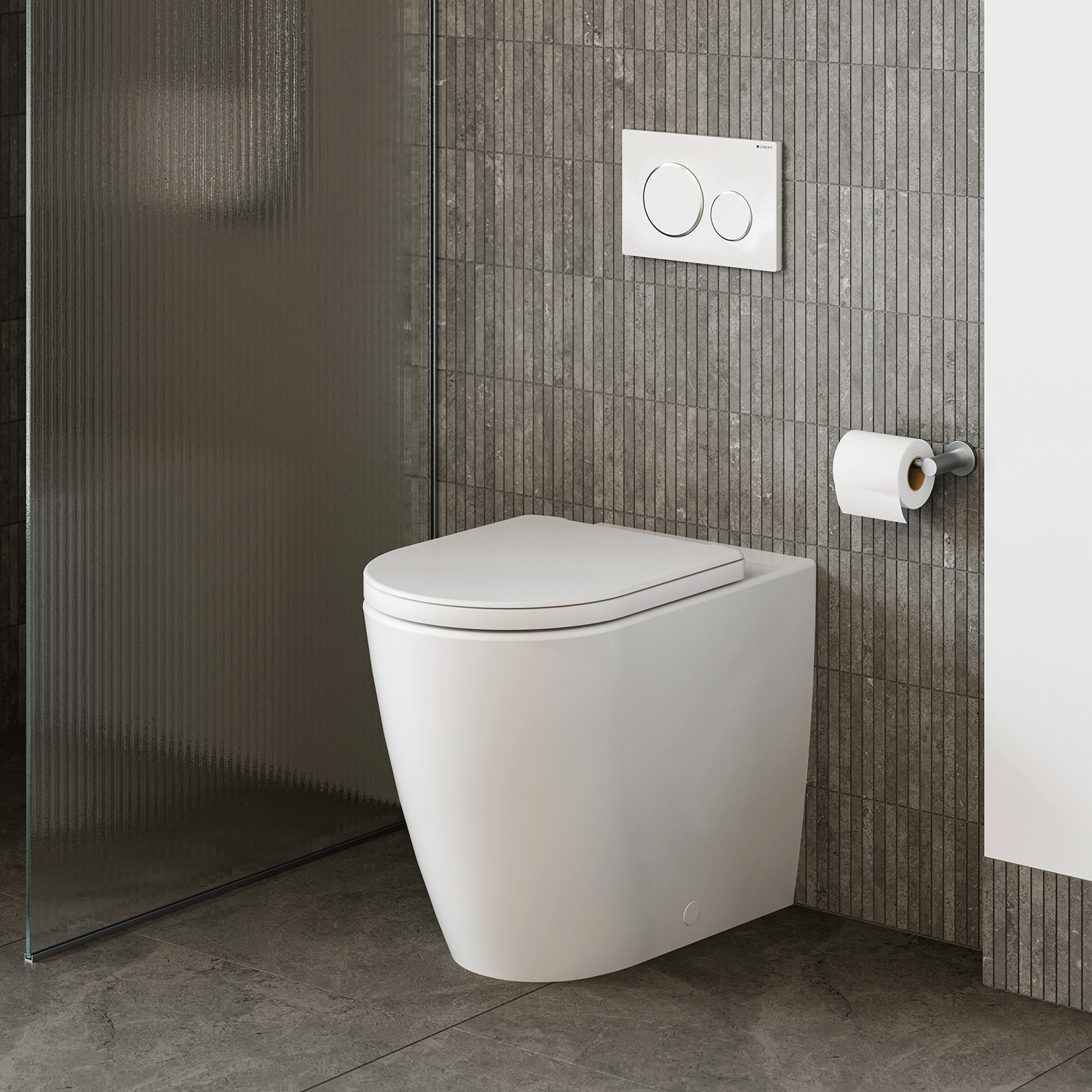 Caroma wall-faced white toilet pan with concealed cistern option, shown in a modern tiled bathroom with flush plate and toilet roll holder