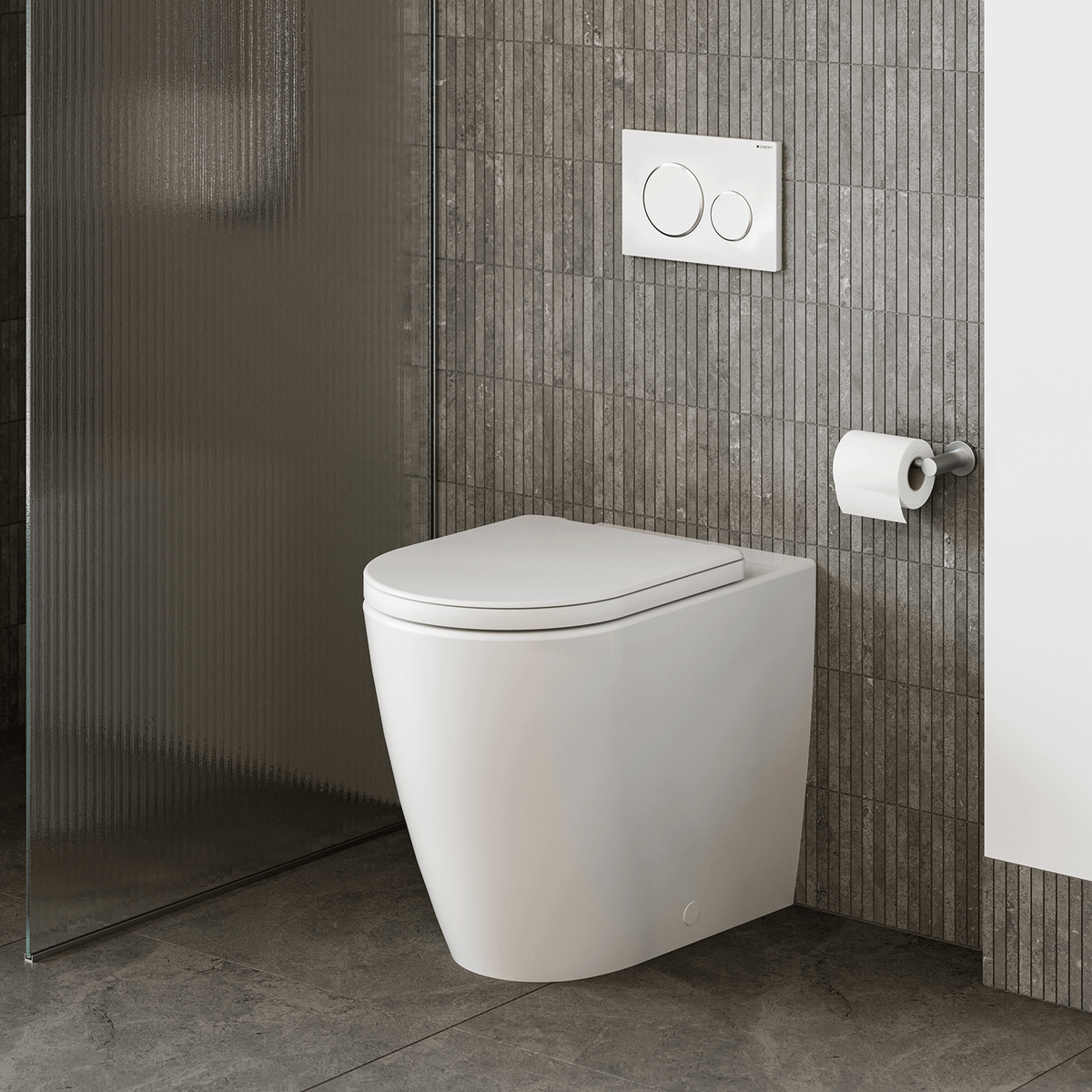 Caroma wall-faced white toilet pan with concealed cistern option, shown in a modern tiled bathroom with flush plate and toilet roll holder