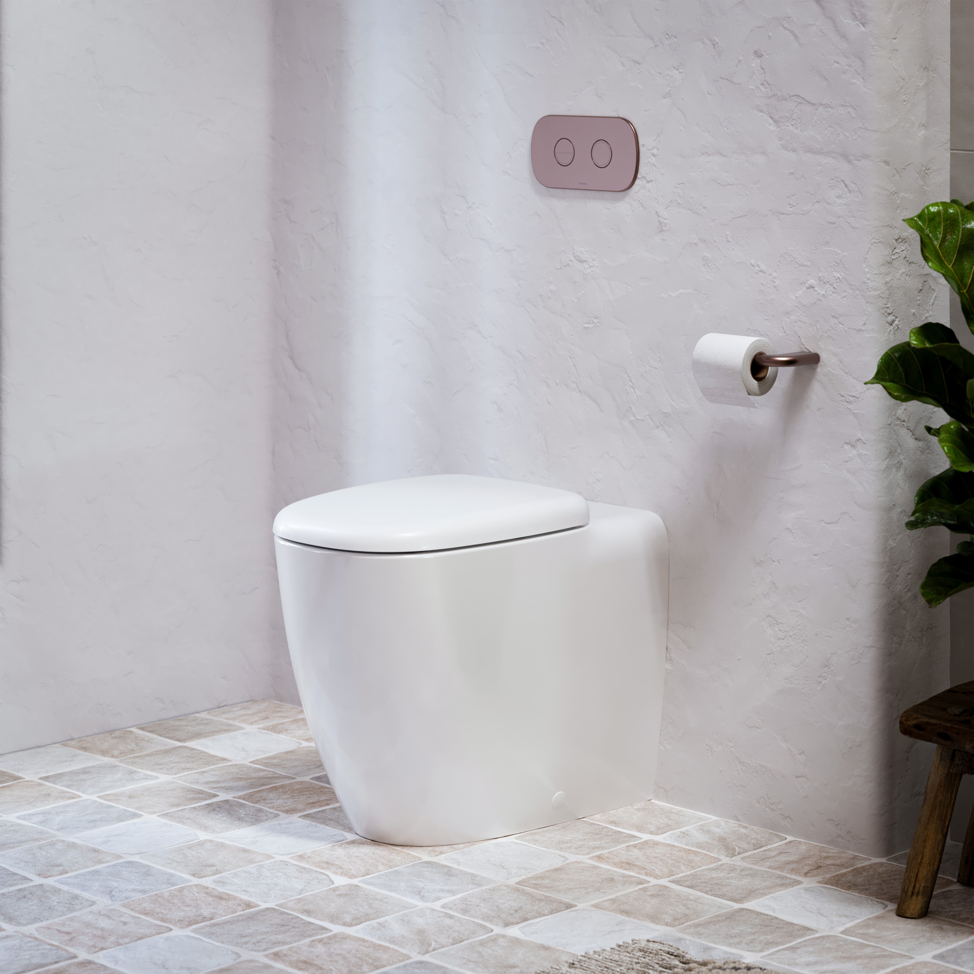 Caroma white wall-faced toilet suite with concealed cistern, flush plate and soft close seat in a tiled bathroom setting