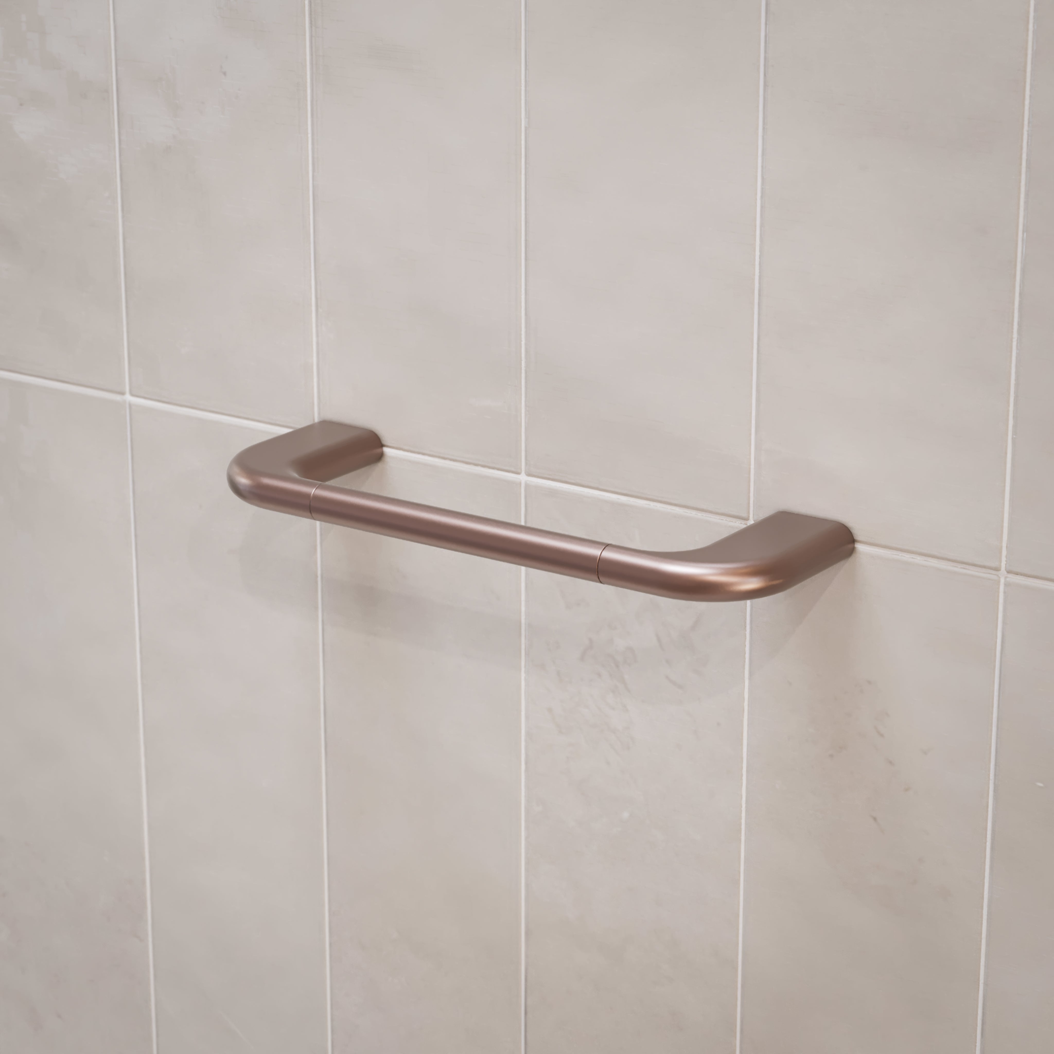 Caroma Contura II hand towel rail in brushed bronze on tiled bathroom wall