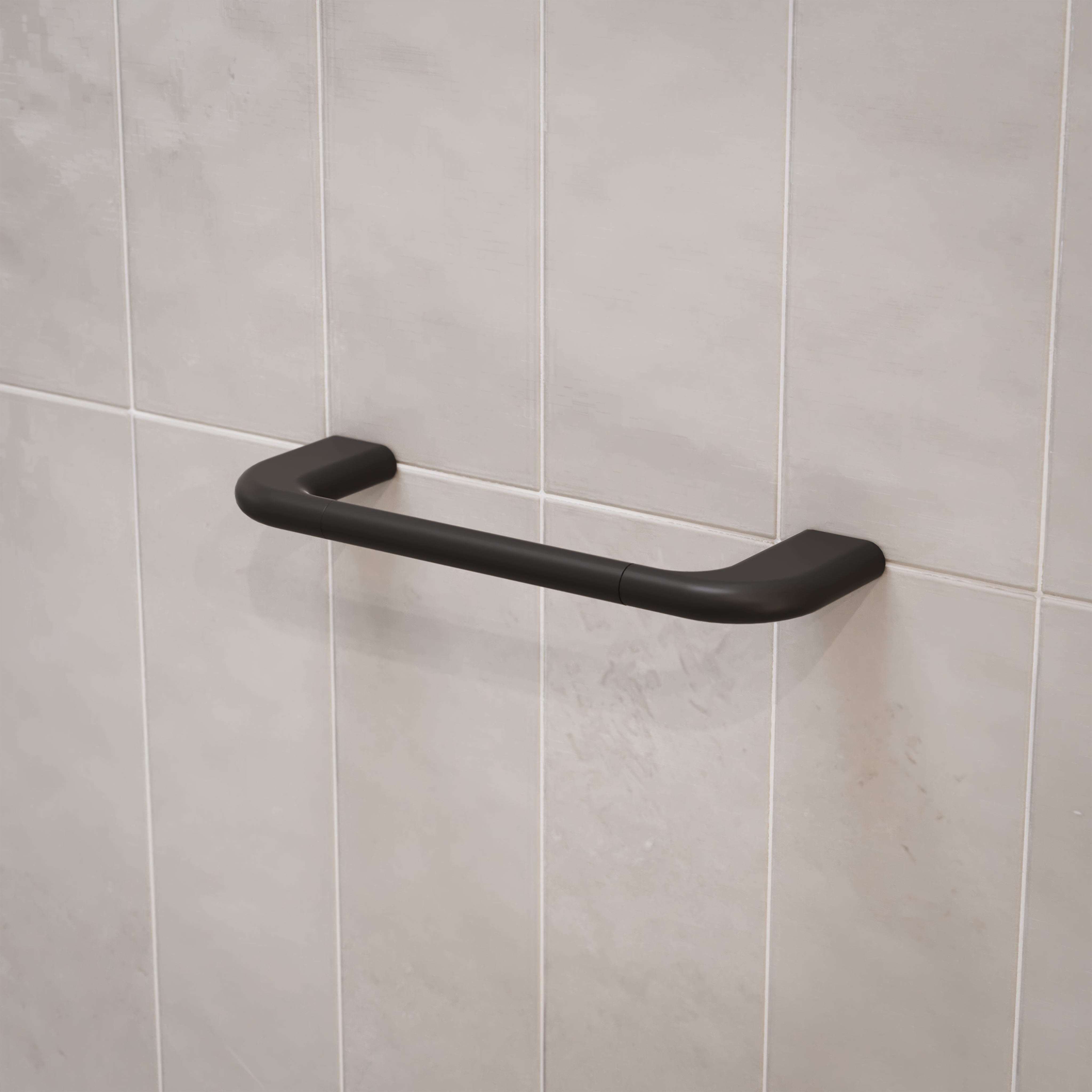 Caroma Contura II matte black hand towel rail mounted on tiled bathroom wall