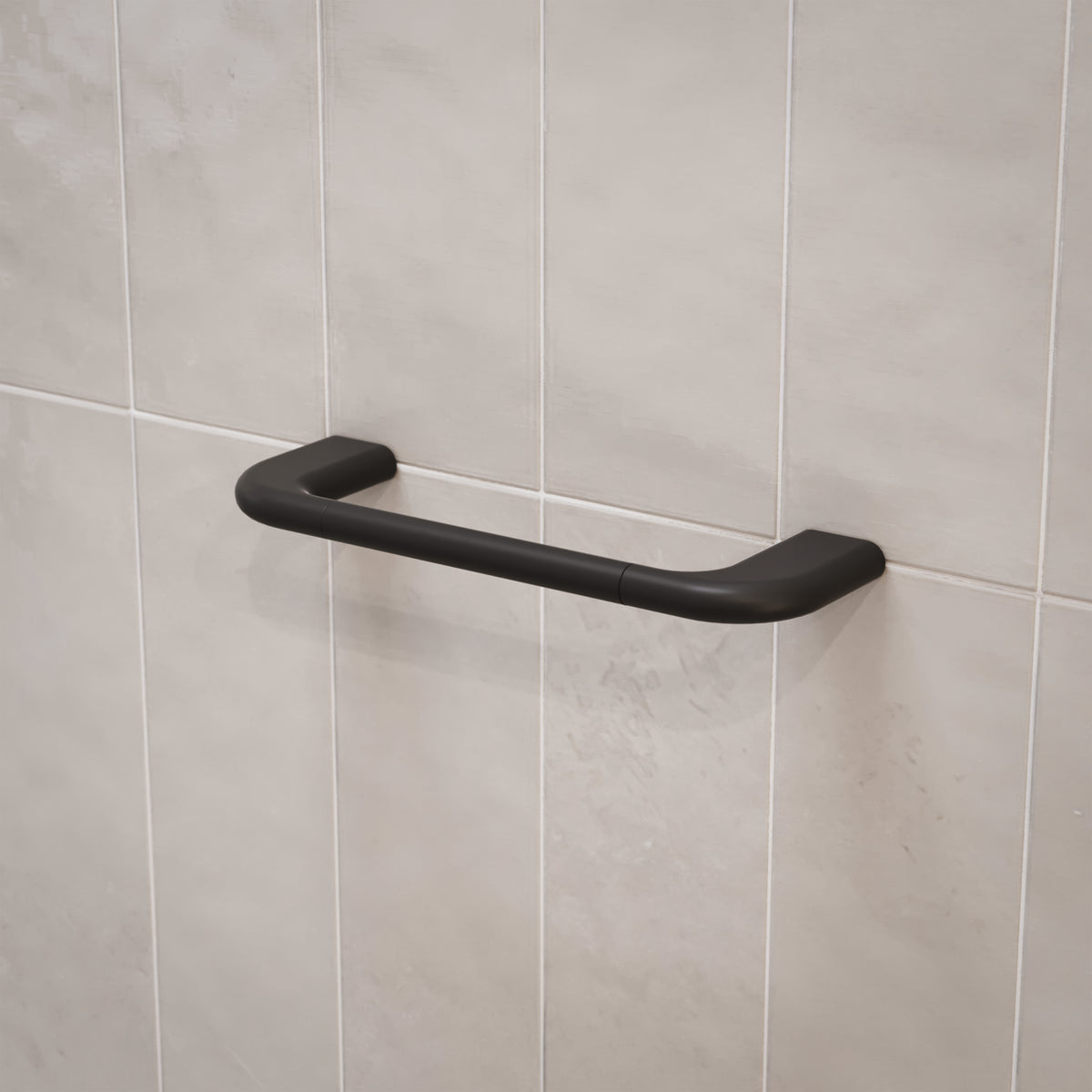 Caroma Contura II matte black hand towel rail mounted on tiled bathroom wall