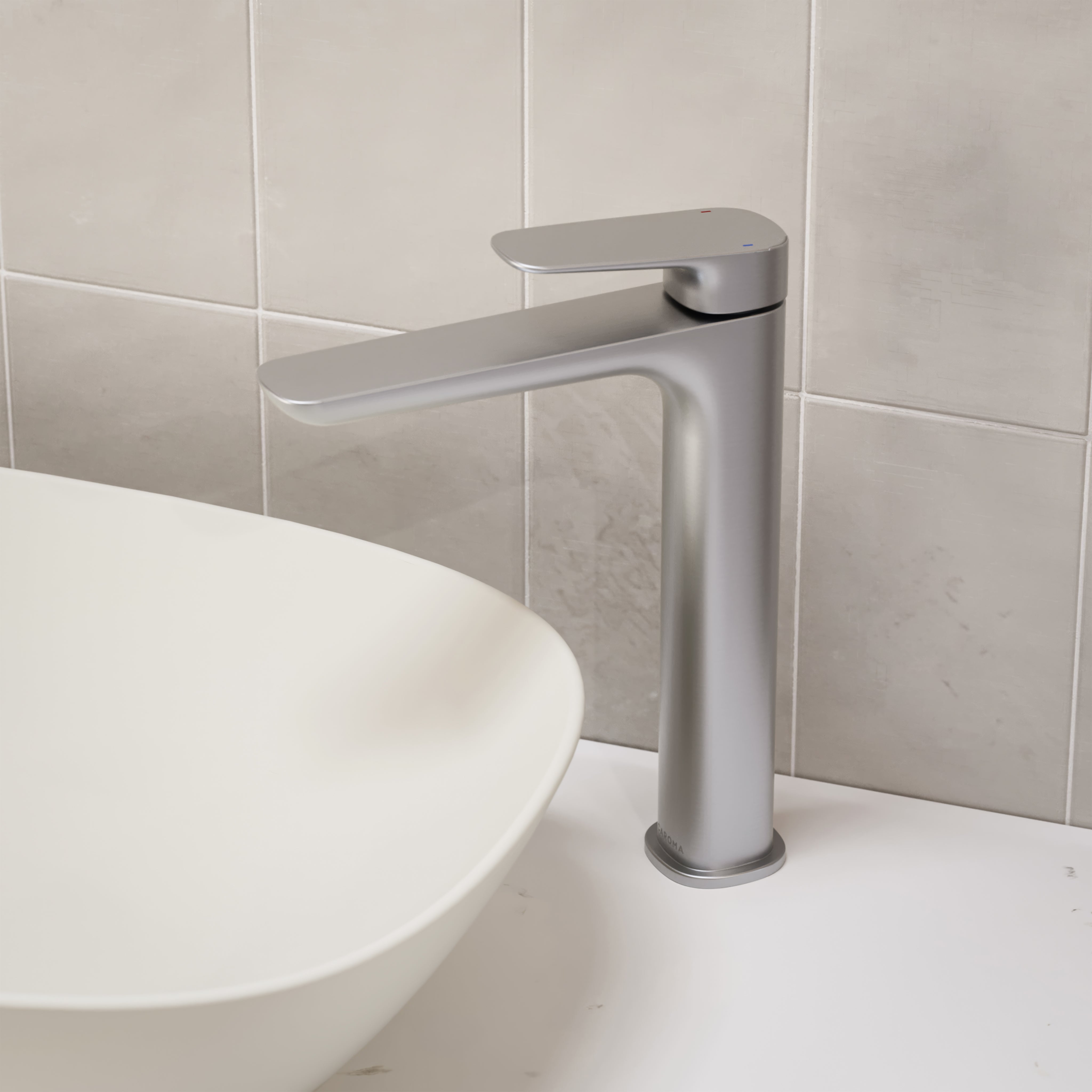 Caroma Contura II tower basin mixer in brushed nickel, hob mounted beside a white vessel basin