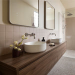 Timberline Delaware wall hung vanity in woodgrain finish with double round above-counter basins in a modern bathroom