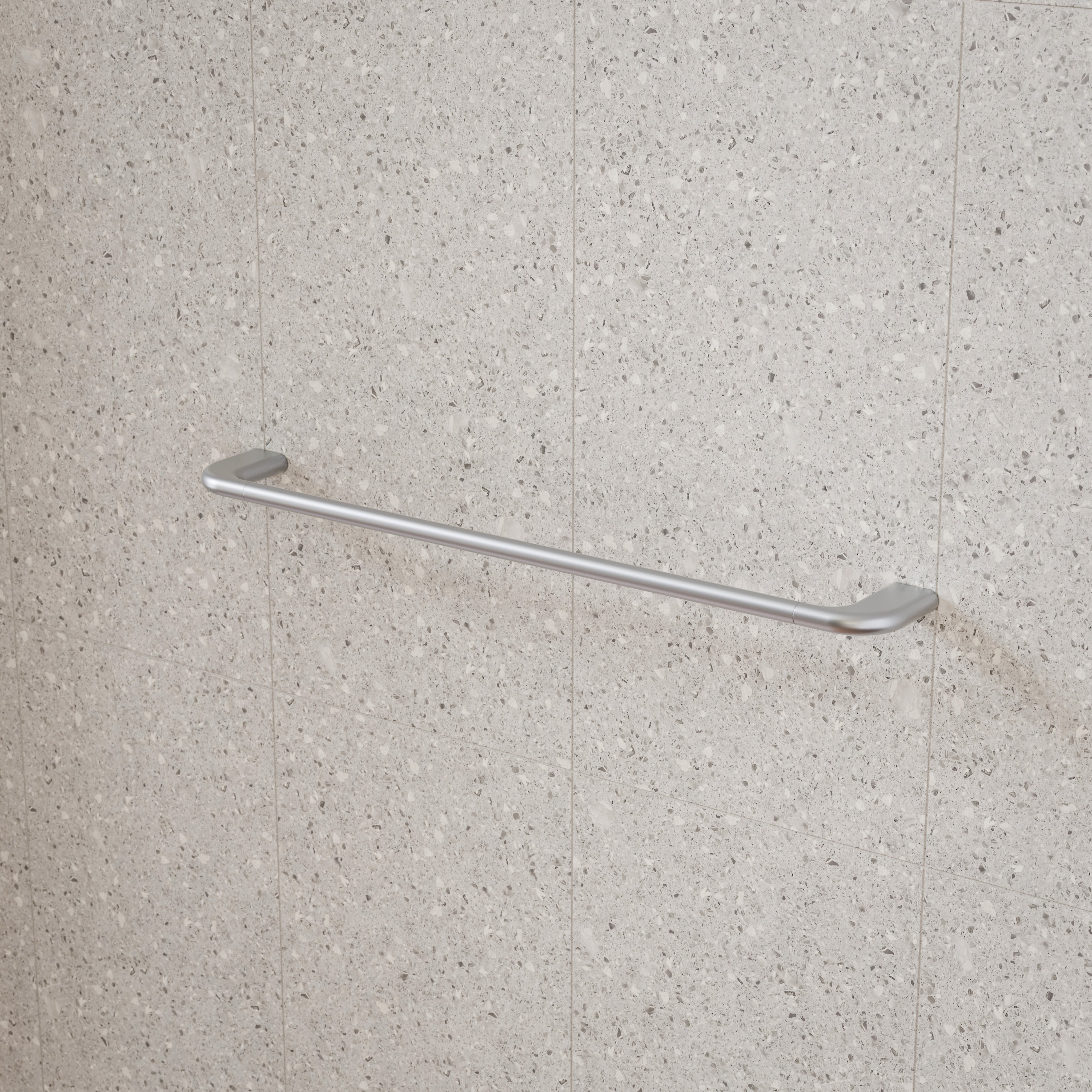Caroma Contura II brushed nickel single towel rail mounted on a tiled bathroom wall