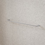 Caroma Contura II brushed nickel single towel rail mounted on a tiled bathroom wall