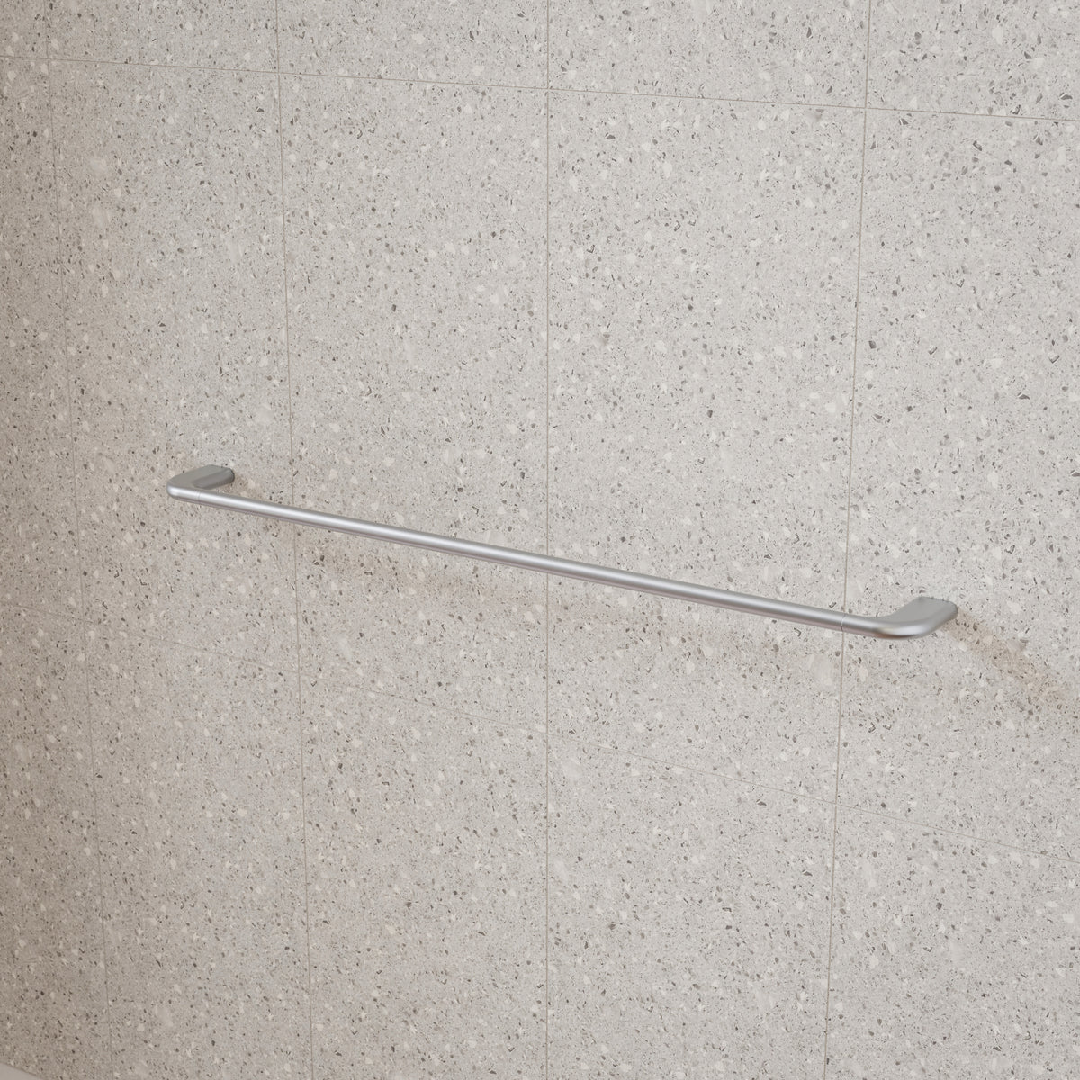Caroma Contura II brushed nickel single towel rail mounted on a tiled bathroom wall