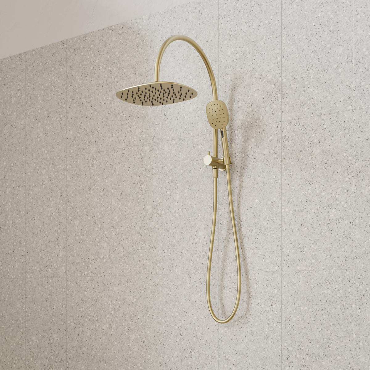 Caroma Contura II compact twin shower in brushed brass, with overhead shower and adjustable hand shower on rail
