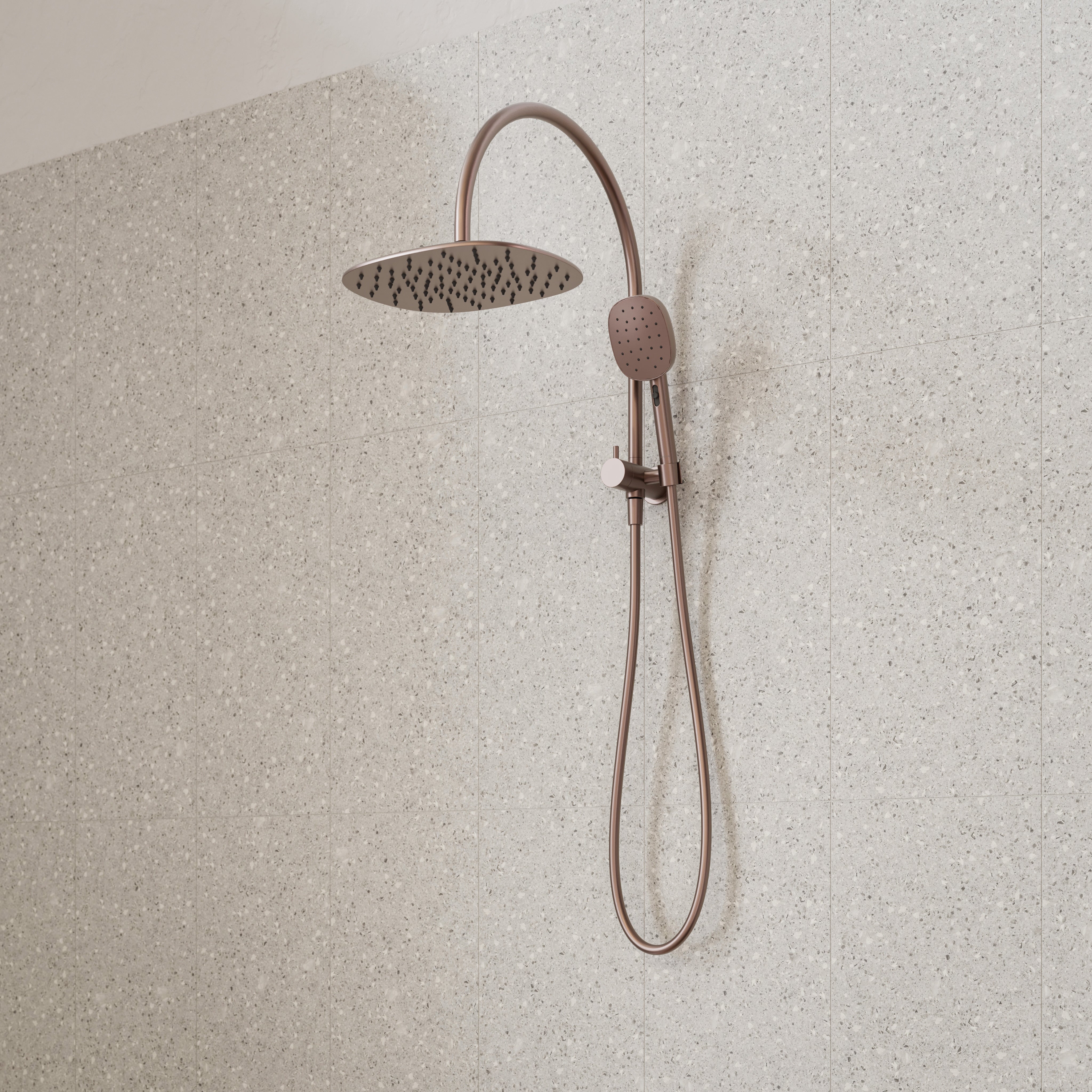 Caroma Contura II compact twin shower in brushed bronze, with round overhead rose and hand shower on rail